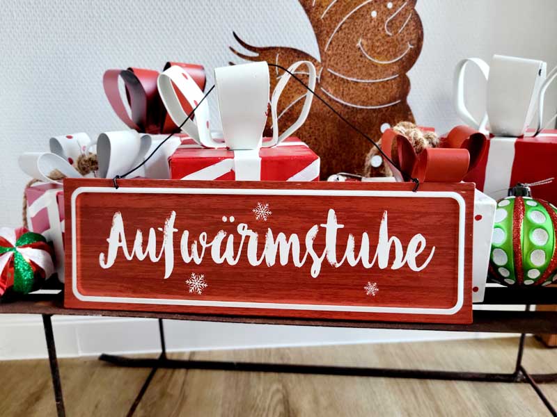 Weihnachtliches Hängeschild "Aufwärmstube" aus Metall 30cm breit